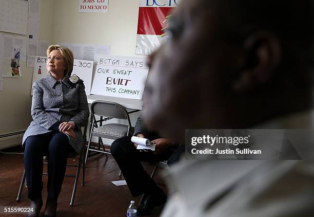 Democratic presidential candidate Hillary Clinton talks with members of the Bakery, Confectionery, Tobacco Workers' and Grain Millers union who lost...