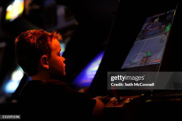 Titan Salankey concentrates as he plays a game on a Neo Geo arcade cabinet at Hyperspace Arcade in Lakewood, Colorado on March 10, 2016. Hyperspace...