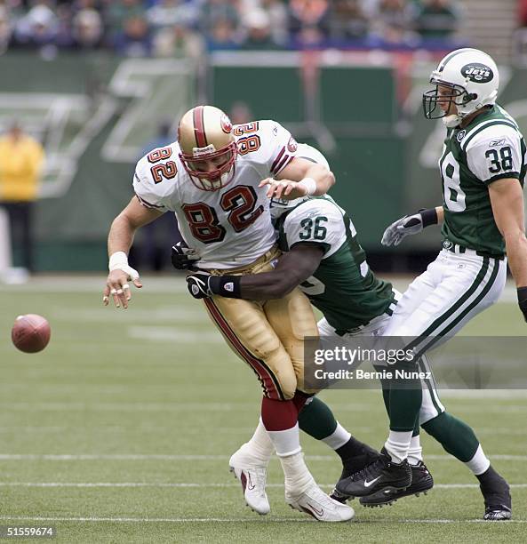 John McGraw and CB David Barrett of the New York Jets break up a pass intended for TE Eric Johnson of the San Francisco 49ers in the game on October...