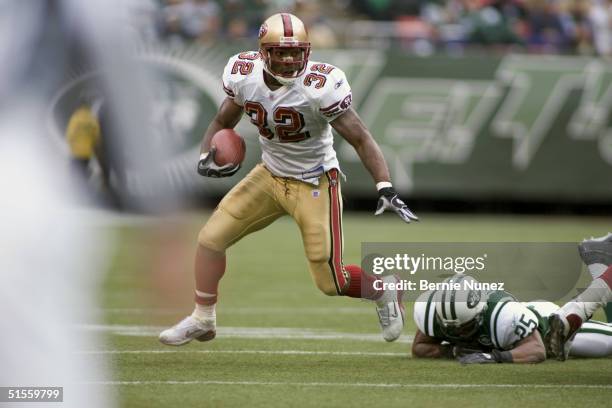 Kevan Barlow of the San Francisco 49ers runs for daylight in the game against the New York Jets on October 17, 2004 at Giants Stadium in East...