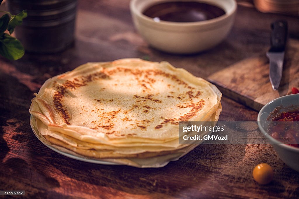 Preparing Baked Crepes Pancakes with Ham and Tomatoes