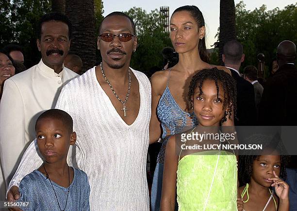 Actor Eddie Murphy arrives at the premiere of his new film " Nutty Professor II" with his family : son Myles, Eddie, wife Nicole, daughter Shane,...