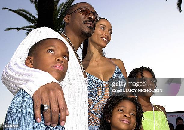 Actor Eddie Murphy arrives at the premiere of his new film " Nutty Professor II" with his family : son Myles, Eddie, wife Nicole, daughter Shane,...