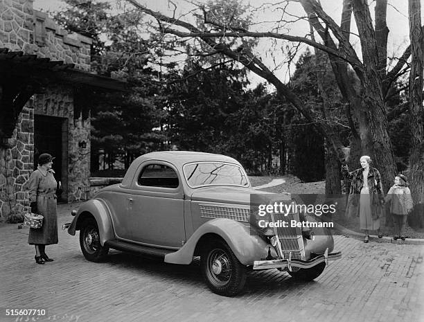 Shown is the new Ford V-8 De Luxe 3 Window Coupe, which has just been announced. The new Ford V-8 cars have new body lines with graceful sloping rear...