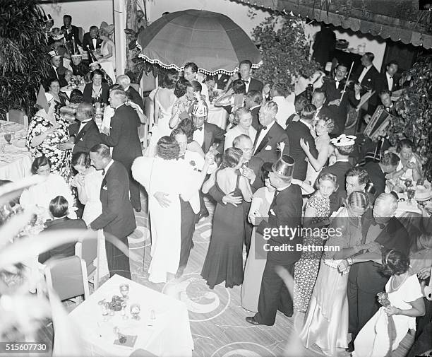 Socialites dancing the old year out and the new year in at "The Patio" in Palm Beach, Fla., where society folk wintering in the South gathered for...