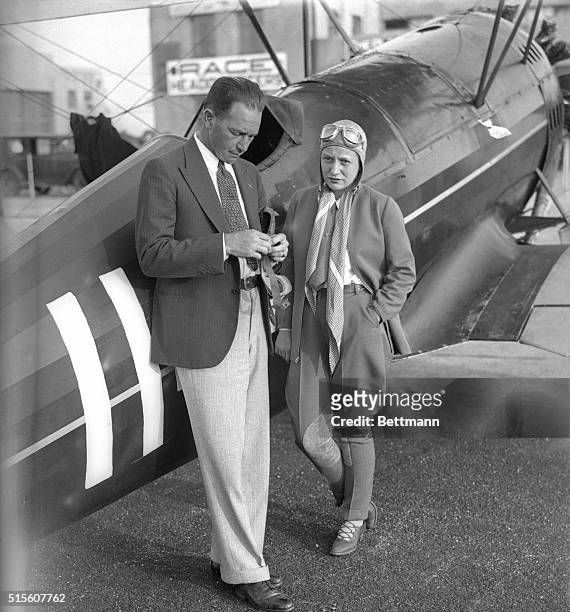 Clyde Fangborn and Mrs. Margey Doig, shown at Roosevelt Field yesterday morning as they started to Cleveland in the William B. Leeds Trophy.