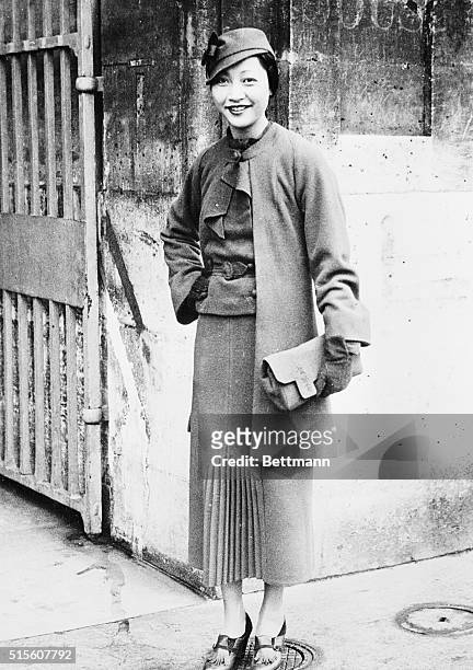 Anna May Wong, popular Chinese film star, pictured in front of the Hotel De Crillon in Paris, shortly after her arrival at the French capital.