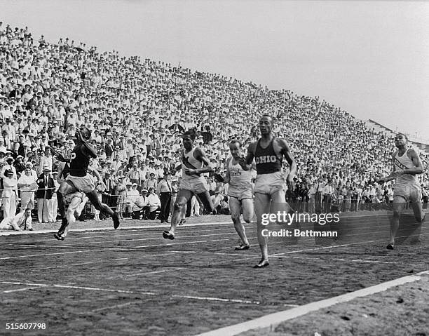 Owens wins 200-meter dash. Randall's Island, NY: Jesse Owens, Ohio State, coming home in front to win the 200-meter dash at the final Olympic Track...