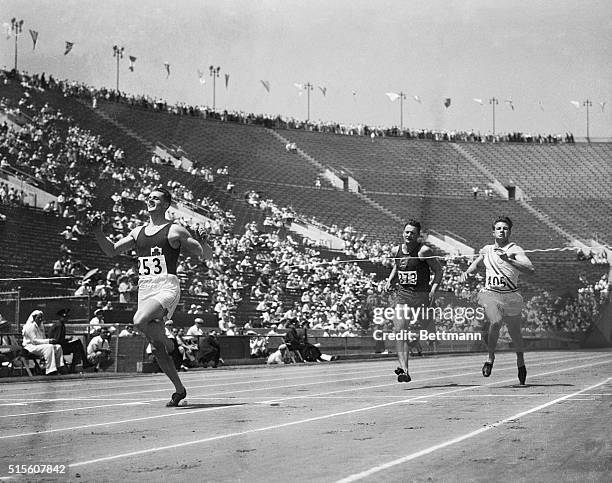 Left to right, competing in the Decathlon 400 meter race at the Olympic Games, are Tisdall of Ireland, H. Hart of South Africa, and Jim Bausch of the...
