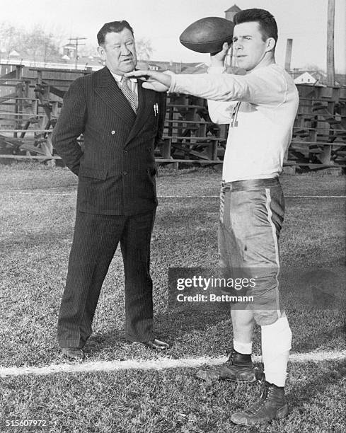 Jim Thorpe, , one of the greatest football players of all time, watches Doug Rehor, a Dickinson College sophomore star, who was leading as small...