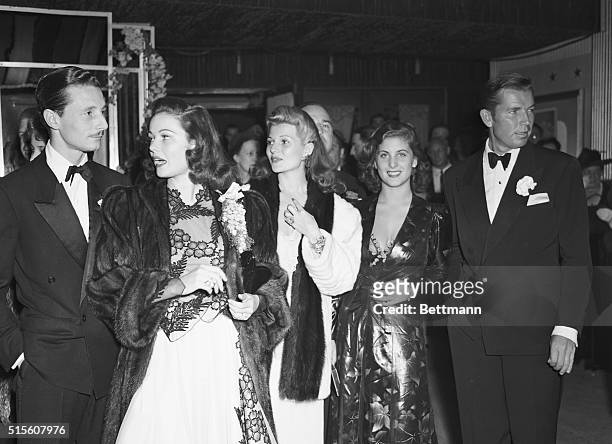 Hollywood: Four Star Theater, Hollywood, California. Premiere Of Sundown. Left to right, Count Oleg Cassini, Gene Tierney, , Rita Hayworth, Virgnina...