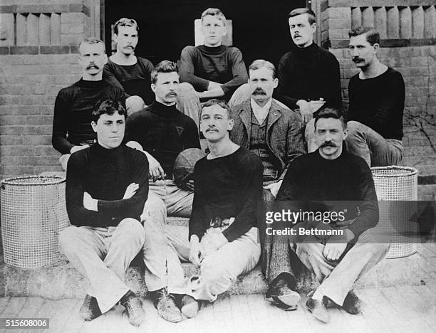 The first basketball team, consisting of nine players and their coach on the steps of the Springfield College Gymnasium in 1891 are shown. Dr....