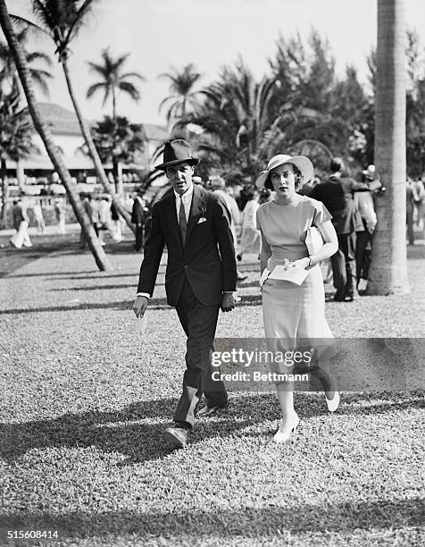 Alfred G. Vanderbilt and Dorothy Fell, pictured as they attended the opening day at Hialeah Park.