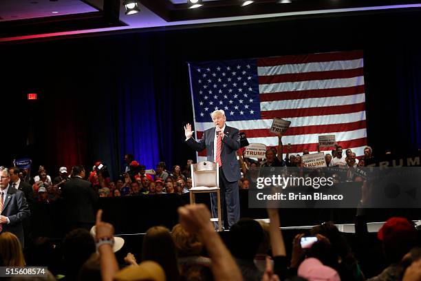 Republican presidential candidate Donald Trump speaks to supporters during a town hall meeting on March 14, 2016 at the Tampa Convention Center in...
