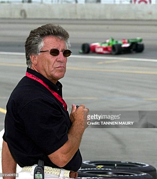 Racing legend Mario Andretti watches the competition during practice for the Target Grand Prix at the Chicago Motor Speedway 29 July 2000 in Cicero,...
