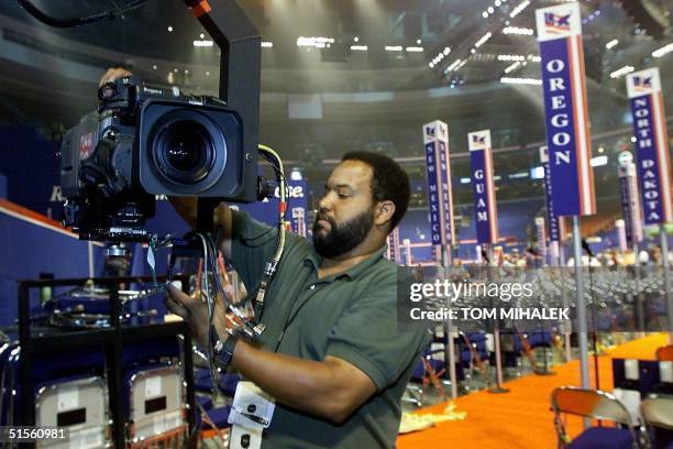 Technician Kevin T. Bailey sets up a jib camera inside Philadelphia's First Union Center 29 July 2000. The First Union Center will be the site of the...