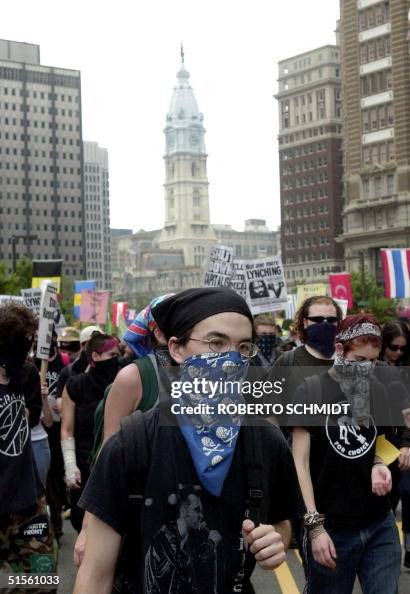 Masked protesters walk away from Philadelphia's Ci Masked protesters walk away from Philadelphia's Ci