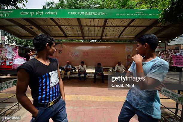 Commuters hit by DTC strike over Mundka killing as people waiting for bus at a stand, on May 11, 2015 in New Delhi, India.