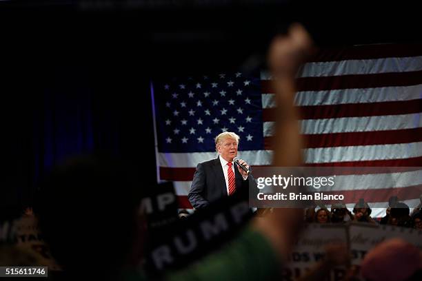 Republican presidential candidate Donald Trump speaks to supporters during a town hall meeting on March 14, 2016 at the Tampa Convention Center in...
