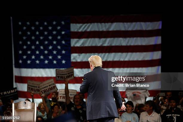 Republican presidential candidate Donald Trump speaks to supporters during a town hall meeting on March 14, 2016 at the Tampa Convention Center in...