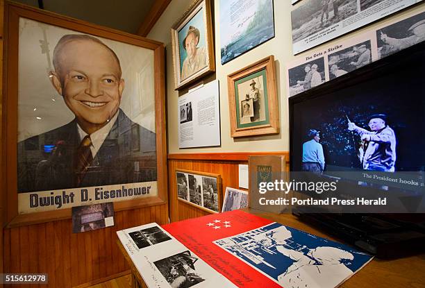 Video showin President Dwight D. Eisenhower holding a fish he caught in the Rangeley area with Gide Don Cameron, plays as part of an exhibit...