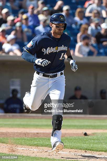 Will Middlebrooks of the Milwaukee Brewers runs to first base against the Colorado Rockies at Maryvale Baseball Park on March 12, 2016 in Phoenix,...