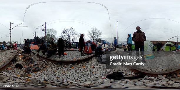 Migrants sit in tent at the Idomeni refugee camp on March 14, 2016 in Idomeni, Greece. The decision by Macedonia to close its border to migrants on...