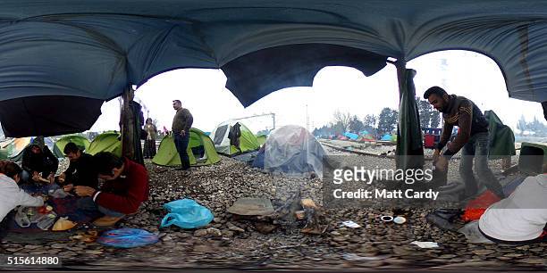 Migrants sit in tent at the Idomeni refugee camp on March 14, 2016 in Idomeni, Greece. The decision by Macedonia to close its border to migrants on...