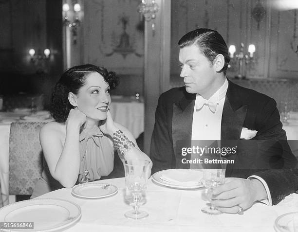 Johnny Weismuller and his wife, the fiery Lupe Velez, pictured as they attended a movie party held by the Mayfair Club at the Ambassador Hotel,...