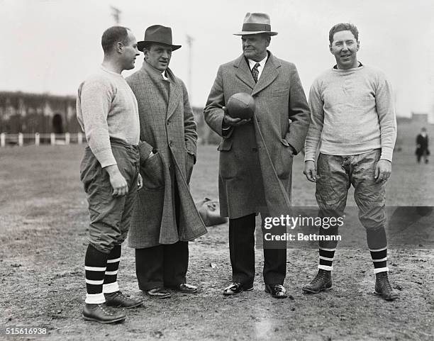 Pop Warner puts Temple gridmen through their paces...Coaching staff of Temple University football team, left to right: Charles Winterburn, Heinie...