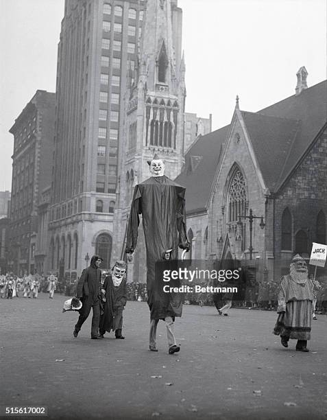Philadelphia, PA: The "Giant Men" parading in the Thanksgiving Day Parade held annually by the Gimbel Brothers Store. INP photo.