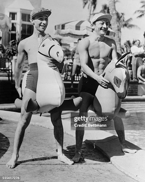 Eddie Arcaro, who rode so brilliantly last year aboard Whirlaway, and Don Meade, the year's champion booter are shown here, as they prepared to enter...