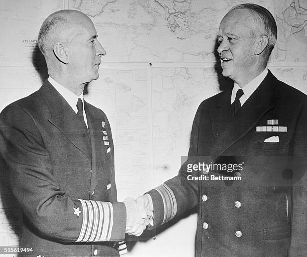 Admiral Ernest J. King , new Commander-in-Chief of the United States Fleet, shakes hands with Rear Admiral Russell Willson, Superintendent of the...