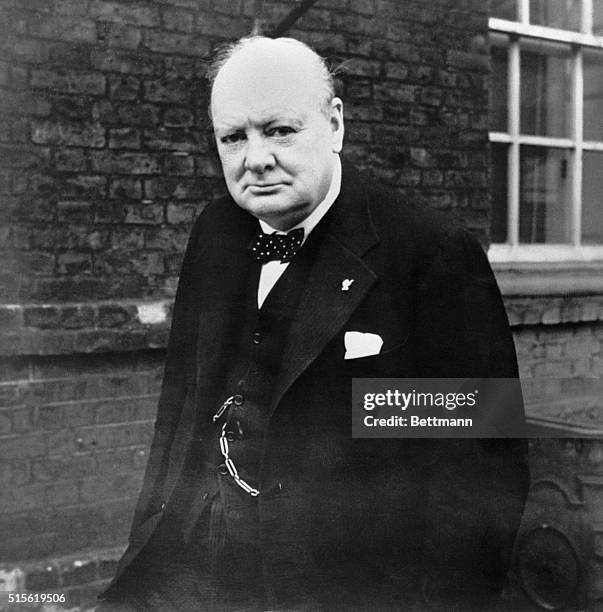 Prime Minister Winston Churchill wearing a thumbs up lapel pin at 10 Downing Street, during World War II.