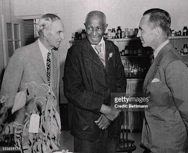 Ford Opens Food Laboratory. Dearborn, Michigan: Henry Ford and son, Edsel, greet Dr. George Washington Carver, noted Negro scientist from Tuskegee...
