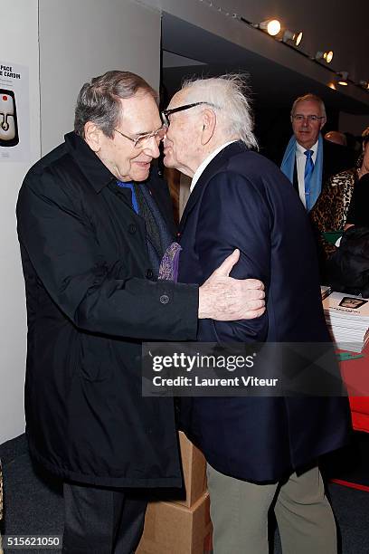 Robert Hossein and Pierre Cardin attend has the signature of the book 'Espace Cardin' by Jean-Pascal Hesse at Espace Pierre Cardin on March 14, 2016...