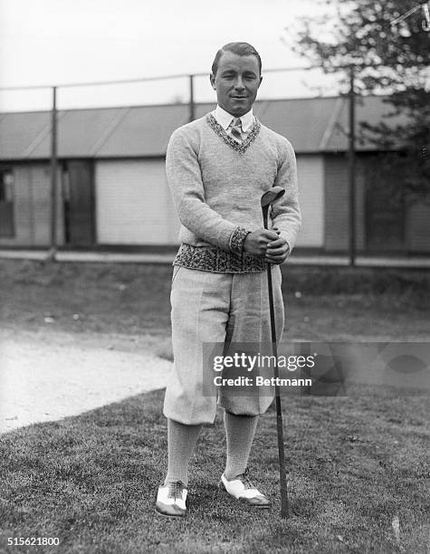 American Golf Champion Gene Sarazen, shown posing with his driver on an unidentified golf course.