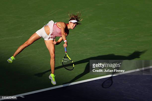 Eugenie Bouchard of Canada serves to Timea Bacsinszky of Switzerland during day eight of the BNP Paribas Open at Indian Wells Tennis Garden on March...