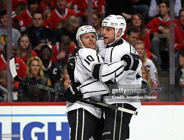 Kris Versteeg of the Los Angeles Kings gets a hug from Milan Lucic after scoring a first period goal against the Chicago Blackhawks at the United...