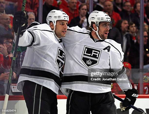 Milan Lucic of the Los Angeles Kings gets a hug from Anze Kopitar after scoring a first period goal against the Chicago Blackhawks at the United...