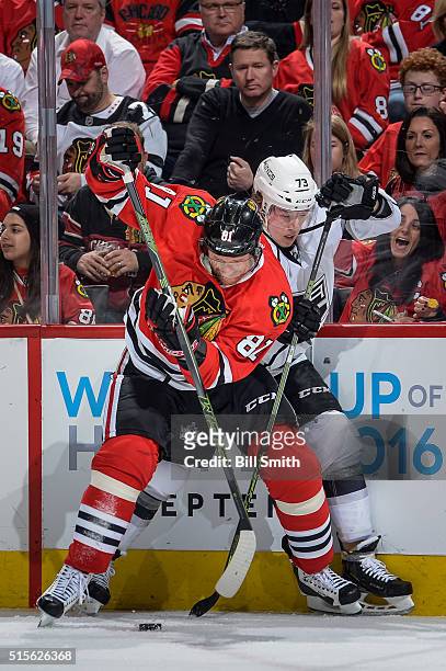 Marian Hossa of the Chicago Blackhawks and Tyler Toffoli of the Los Angeles Kings battle for the puck in the first period of the NHL game at the...