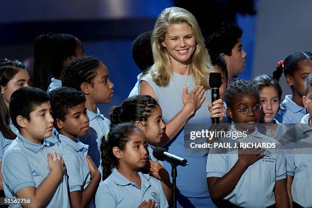 Supermodel Christie Brinkley is joined by children representing the Boys and Girls Clubs of America as they give the "Pledge of Allegiance" at the US...