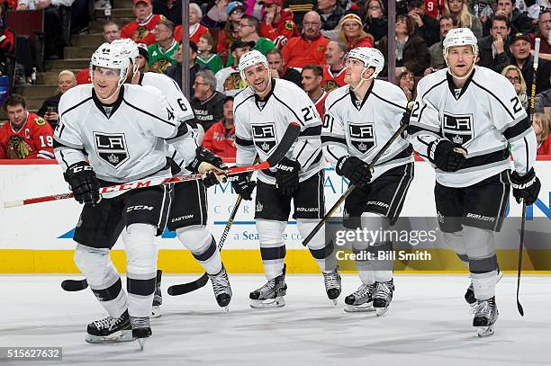 Vincent Lecavalier, Alec Martinez, Tanner Pearson and Trevor Lewis of the Los Angeles Kings skate toward the bench after Lecavalier scored in the...