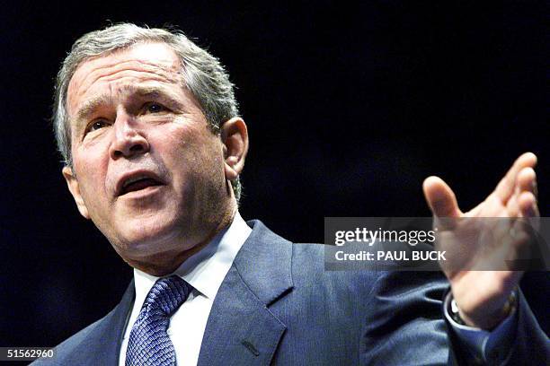 Governor of Texas and GOP presidential candidate George W. Bush addresses supporters during a campaign rally at Moody Coliseum on the campus of...