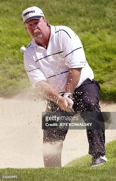 Golfer Craig Stadler of the US blasts out of the trap on the third hole 19 August, 2000 during the third round of the 82nd PGA Championship at...