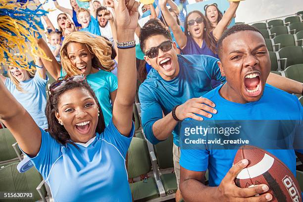 football crowd cheering for their sports team - american football sport stock pictures, royalty-free photos & images