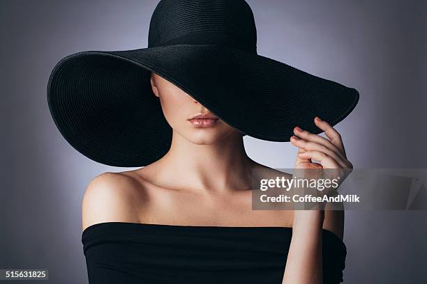 studio shot of young beautiful woman - hat stock pictures, royalty-free photos & images