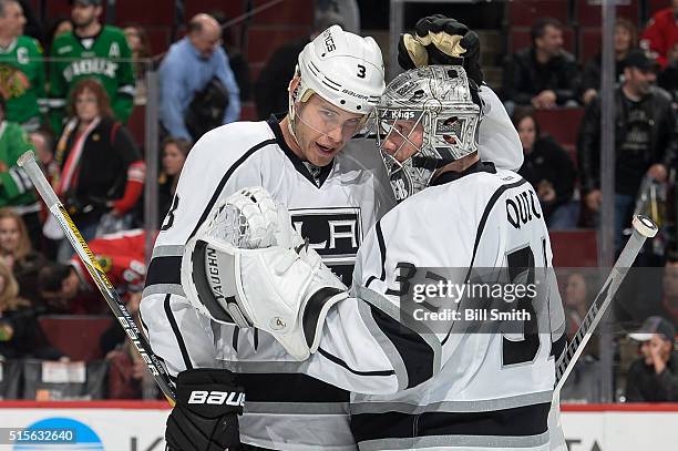 Brayden McNabb and goalie Jonathan Quick of the Los Angeles Kings celebrate after shutting out the Chicago Blackhawks 5 to 0 during the NHL game at...