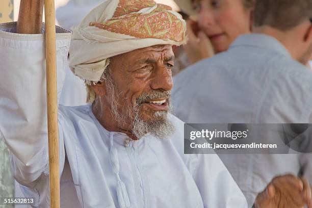 man at a cattle market in the middle east - salalah stock pictures, royalty-free photos & images
