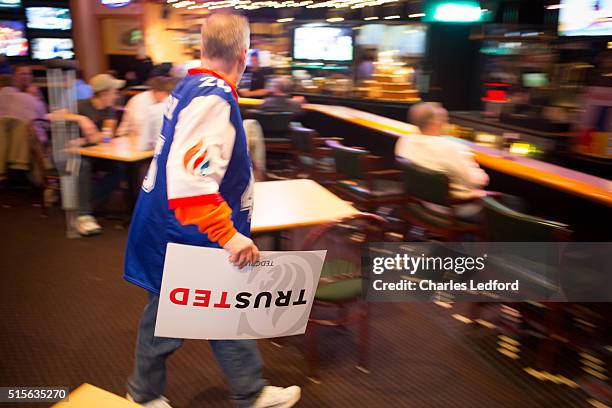 Guest leaves a restaurant adjacent to the site of a campaign rally for Republican presidential candidate, U.S Senator Ted Cruz after the event on...